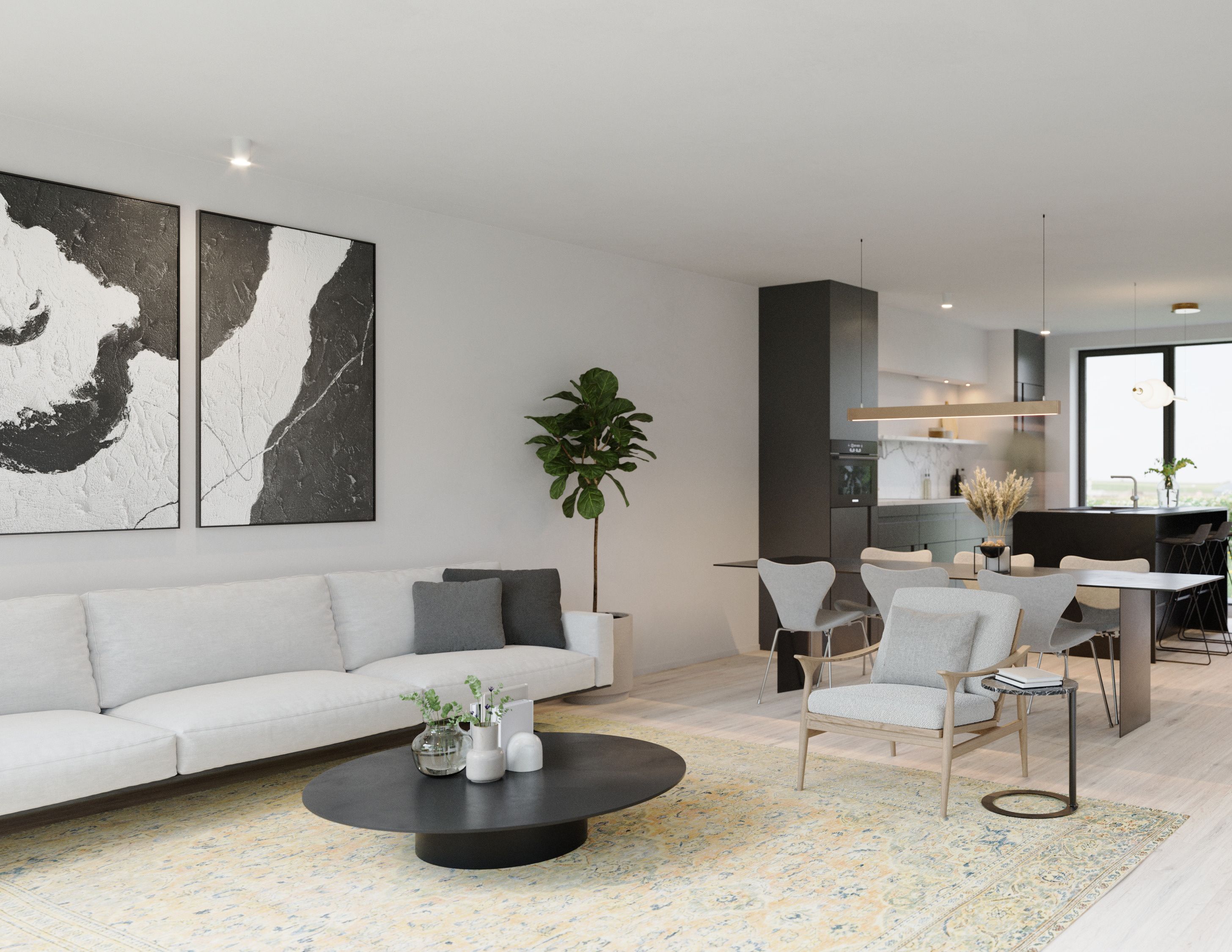 Intérieur d'une maison à Waremme. Il y a un salon en avant-plan et une cuisine en arrière-plan