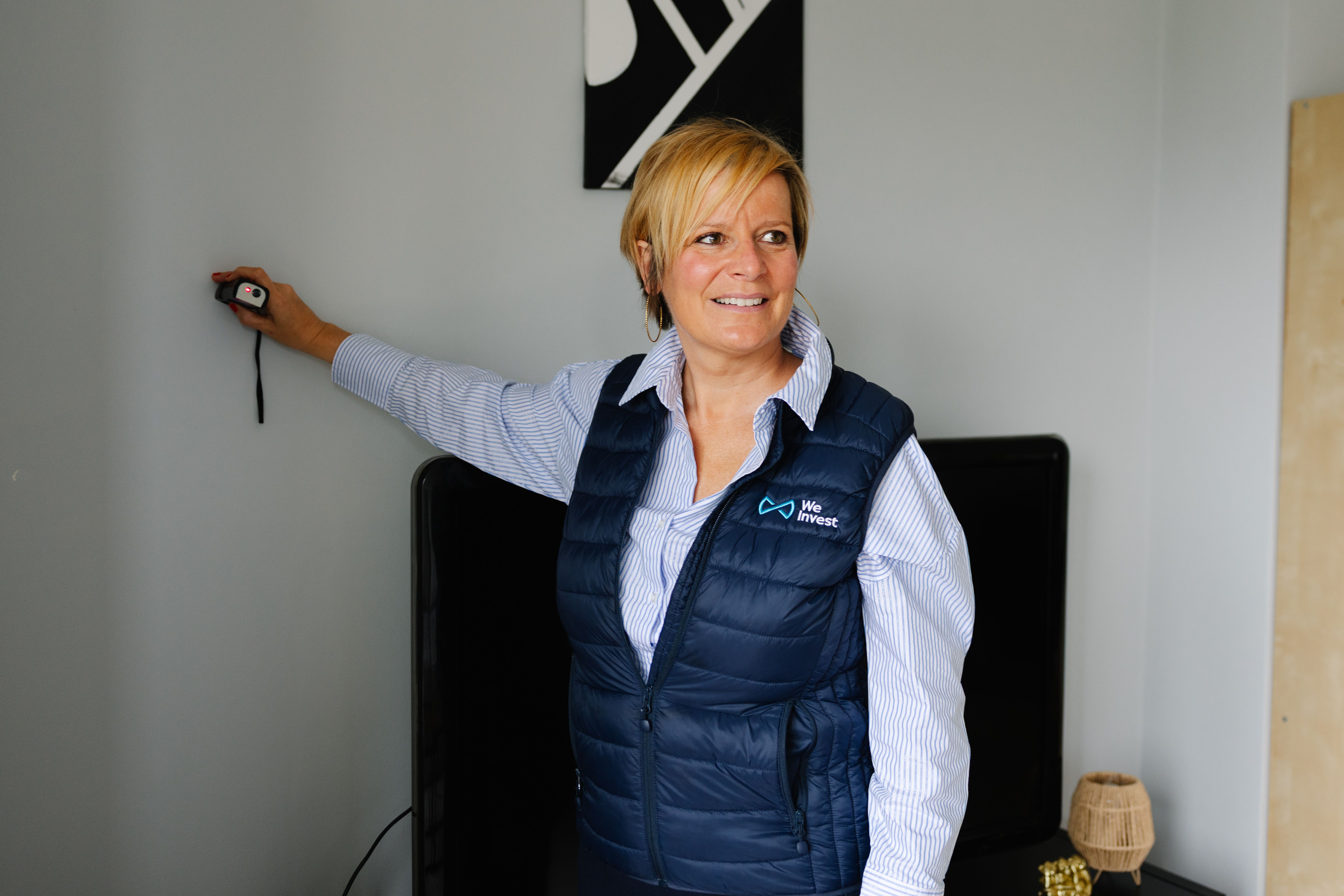 Agent immobilier We Invest réalisant un rapport d'estimation à Liège